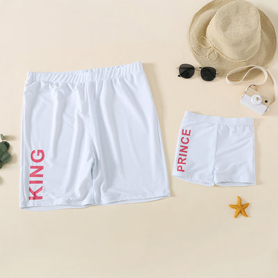 Rose pink one-piece swimsuit with 'QUEEN' printed in white on the front, featuring a scoop neck and tank straps. - Image 9