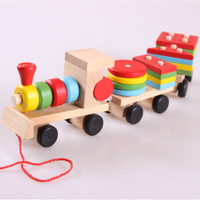 Wooden toy train with a locomotive and two carriages, each carrying colorful shape-sorting blocks. - Image 7