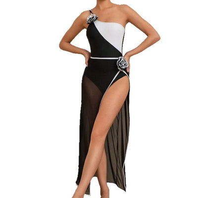 Black and white colorblock one-shoulder swimsuit with 3D flowers and sheer black mesh high-slit skirt. - Image 6