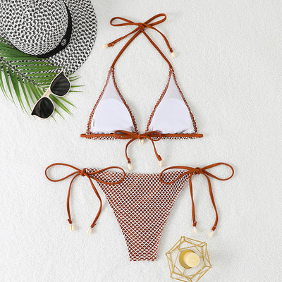 Blue and white mesh triangle bikini set with tie-side bottom and shell accents, displayed on a white beach towel. - Image 28