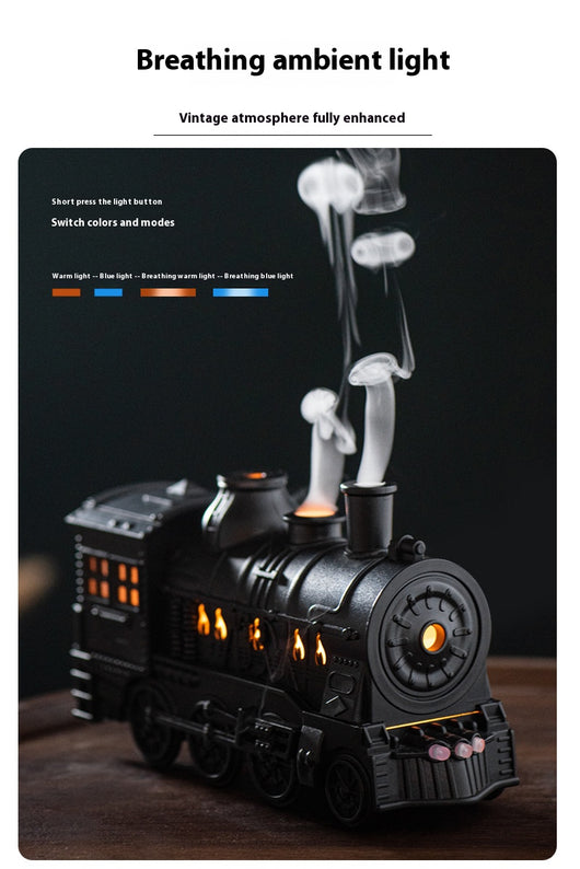 Black train-shaped essential oil diffuser and humidifier with retro design, emitting mist and glowing lights. - Image 3