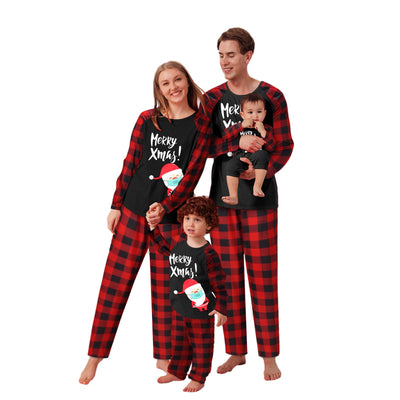 Family matching Christmas pajamas with black tops, red plaid sleeves, and Santa wearing a mask, paired with red plaid pants. - Image 4