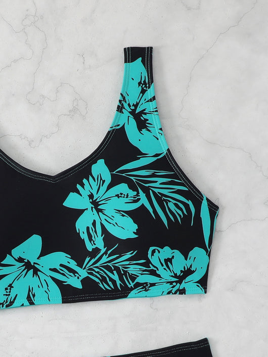 Women's two-piece swimsuit with black and purple floral print. Features a V-neck sports bra top and mid-rise bottom. - Image 10
