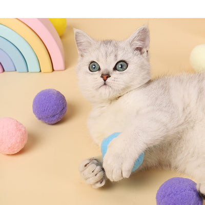 Five colorful plush balls in a white gift box, including pink, yellow, blue, purple, and bright yellow. - Image 8
