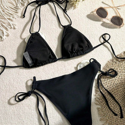 Black two-piece bikini with white 3D flower embellishments on the triangle top and tie-side bottom. - Image 2