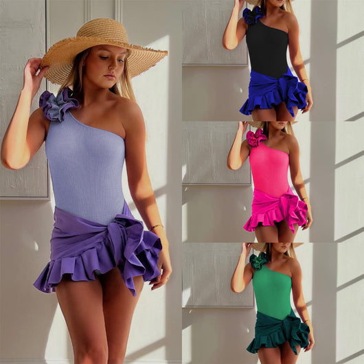 Black one-shoulder ribbed one-piece swimsuit with a ruffled blue and black strap, ideal for women's swimwear.