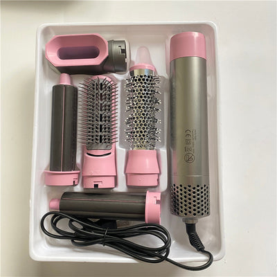 5-in-1 hot air comb hair dryer set with multiple rose red and gray attachments in a white tray. - Image 6