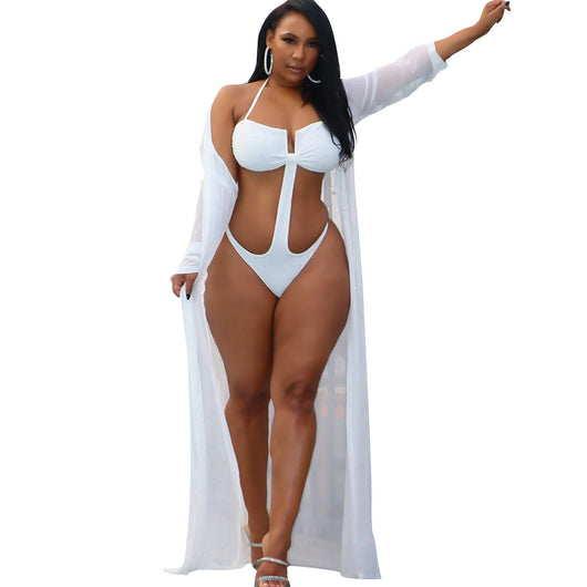 Woman in black mesh see-through long sleeve swimsuit cape over a matching cutout bandeau swimsuit with hot drilling. - Image 13