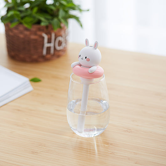 Two white and pink rabbit-shaped mini portable humidifiers, one facing forward and one showing the USB port. - Image 10