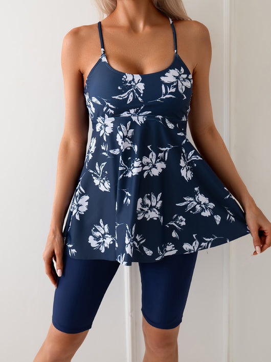 Women's navy blue two-piece swimsuit with white floral tankini top and matching solid swim shorts. - Image 7