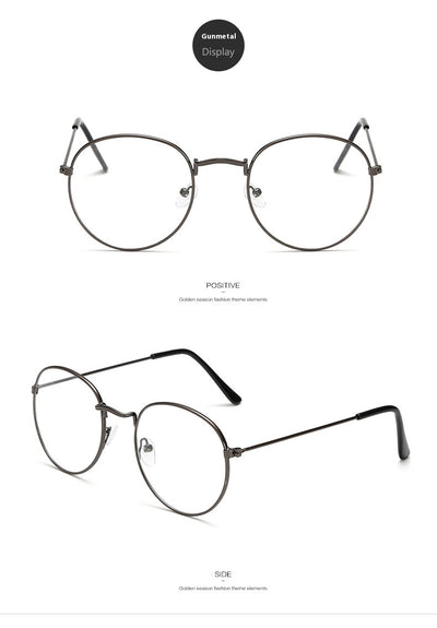 Retro oval anti-blue light glasses with a dark metal frame and clear lenses on a white background. - Image 15