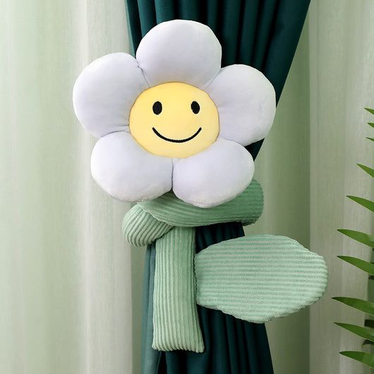 Plush white sunflower curtain buckle with a yellow smiley face center and green stem, holding back a dark green curtain. - Image 2
