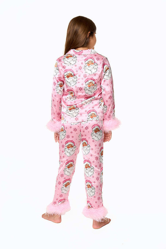 Young girl in a leopard print pajama set with black feather trim on the cuffs and ankles, wearing a pink glitter headband. - Image 28