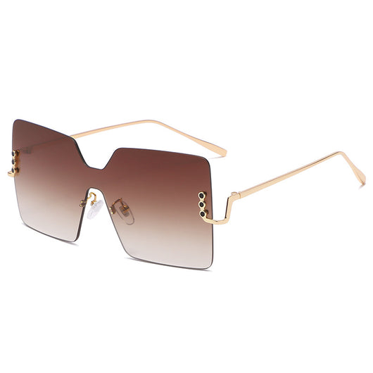 Frameless oversized square sunglasses with brown gradient lenses and gold-tone metal temples, featuring decorative black studs. - Image 24