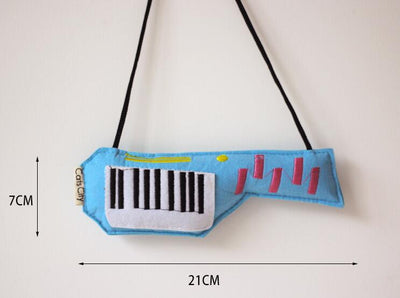 Light blue felt catnip toy shaped like a game controller with piano keys and a black string for hanging. - Image 7