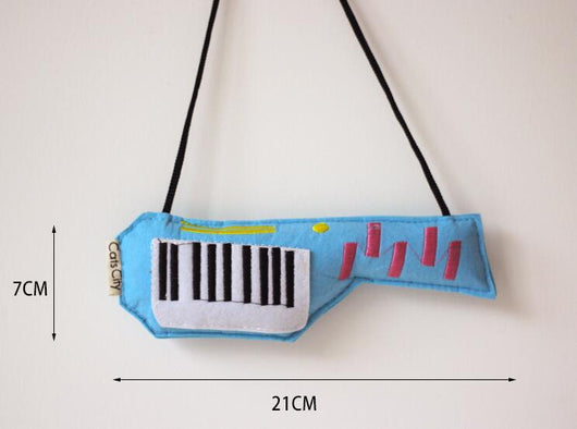 Light blue felt catnip toy shaped like a game controller with piano keys and a black string for hanging. - Image 7