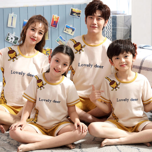 Family of four in matching light blue cotton short-sleeved pajamas with cartoon animal pocket design and 'SLEEP' text.