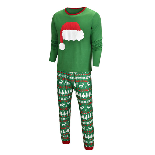Green Christmas family pajama sets with Santa hat graphic tops and pants featuring reindeer, trees, and snowflakes. - Image 2
