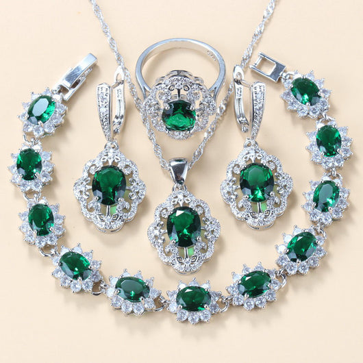 Four-piece jewelry set with silver-tone settings, featuring oval purple cubic zirconia stones surrounded by clear accents. - Image 20