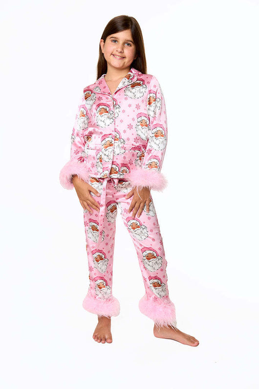 Young girl in a leopard print pajama set with black feather trim on the cuffs and ankles, wearing a pink glitter headband. - Image 23
