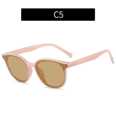 Jelly yellow frame sunglasses with green lenses, featuring a rounded cat-eye shape for UV protection and fashion. - Image 4