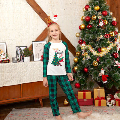 Men's Christmas pajama set with a white top featuring a Santa and Christmas tree graphic, and green plaid pants. - Image 9