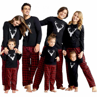 Mom's black long-sleeve pajama top with white deer head print and red and black plaid pajama pants. - Image 16