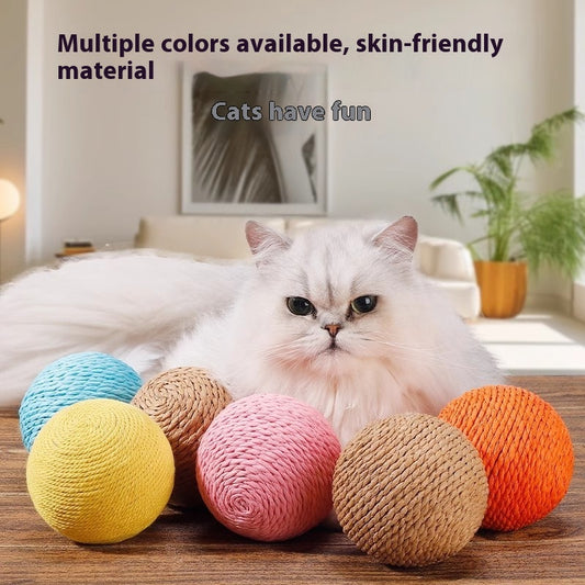 Oversized sisal ball cat toy in natural primary color, displayed on a light beige pedestal.