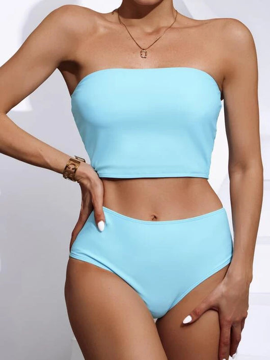 Vibrant orange strapless bandeau bikini top and high-waisted bottoms set, worn by a woman with a white shirt. - Image 13