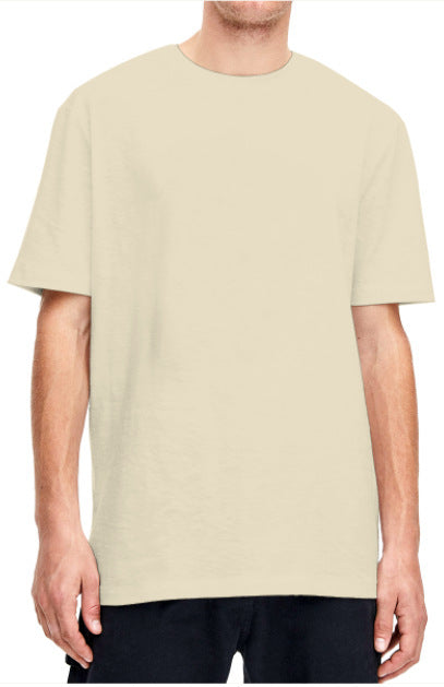 Plain light beige short-sleeved crew neck t-shirt made of cotton, shown on a model. - Image 27