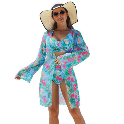 Multicolor tropical print three-piece swimsuit set with high-waisted bikini and sheer mesh cover-up on a beach. - Image 5