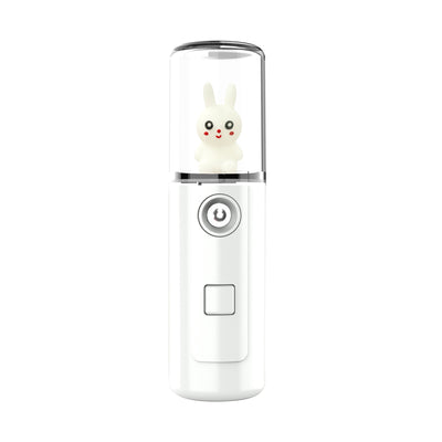 Green portable facial mister with a clear top and a white cartoon rabbit figure inside, featuring a power button. - Image 10