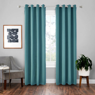 Light gray polyester blackout curtains with grommet tops hanging on a white rod in a modern living room. - Image 13