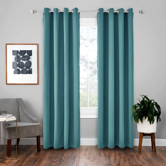 Light gray polyester blackout curtains with grommet tops hanging on a white rod in a modern living room. - Image 13