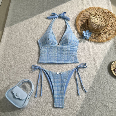 Light blue textured plaid two-piece swimsuit with a halter top and side-tie bikini bottoms, featuring small white bows. - Image 9