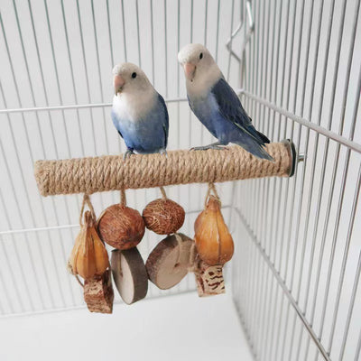 Hemp rope braided bird perch with natural wood slices and seed pods hanging, attached inside a wire bird cage.