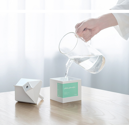 Pink milk carton shaped humidifier with a white label, featuring "Milkbox Humidifier" text and a bcase logo. - Image 17