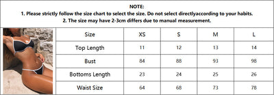 Black and white strapless bikini swimsuit set with adjustable straps and a ruched bottom, laid flat. - Image 7