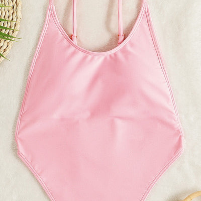 Light pink one-piece swimsuit with thin spaghetti straps and a high-cut leg design, worn by a woman. - Image 7