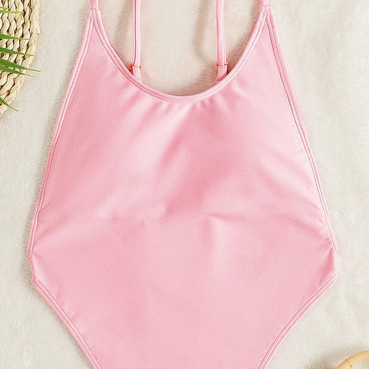 Light pink one-piece swimsuit with thin spaghetti straps and a high-cut leg design, worn by a woman. - Image 7
