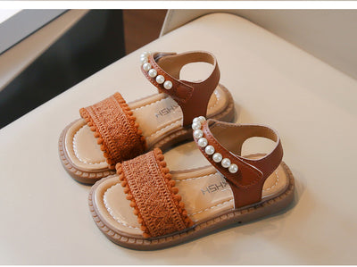 Children's white sandals with pearl ankle straps, woven front strap, and brown sole, featuring a Velcro closure. - Image 8