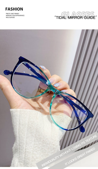 Black full-frame round anti-blue light glasses held by a hand with a gold ring and light blue gradient nails. - Image 24