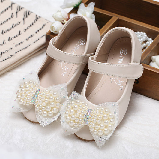 Beige girls' princess shoes with pearl and rhinestone bows, featuring a flat heel and a convenient Velcro strap. - Image 7