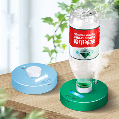 White round portable USB humidifier with a night light, single fog outlet, and two control buttons.