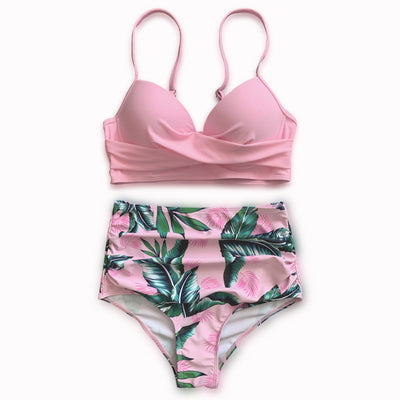 Woman wearing a bright yellow push-up bikini top and high-waisted bottoms with a green tropical leaf print. - Image 5