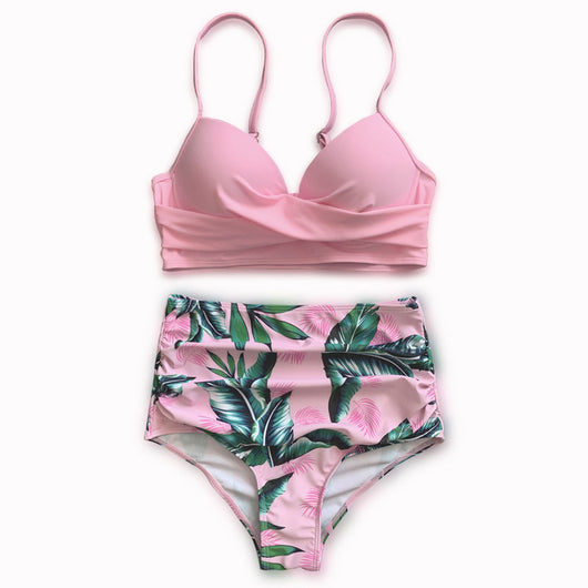 Woman wearing a bright yellow push-up bikini top and high-waisted bottoms with a green tropical leaf print. - Image 5