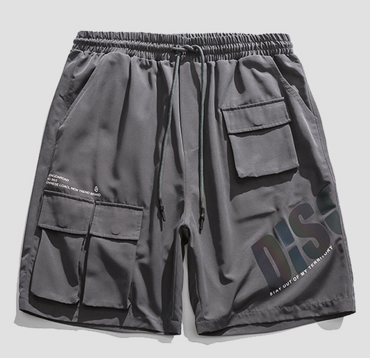 Pantalones Cortos Tipo Overol para Hombre con Detalles Reflectantes y Colores Vibrantes