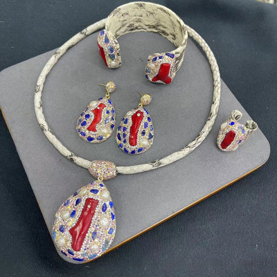 Four-piece jewelry set with white snakeskin leather, red coral-like inlays, pearls, and gemstones. - Image 5