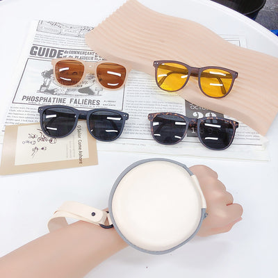 Light brown foldable women's sunglasses with round frames and brown polarized lenses on a white background. - Image 16