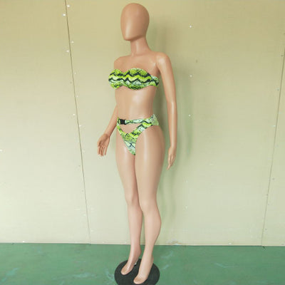 Woman in a purple and pink snakeskin print three-piece swimsuit with an off-shoulder crop top and high-waisted bottoms. - Image 17